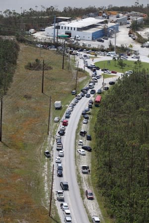 An aerial view shows cars lined up to cross a damaged bridge after hurricane Dorian hit the Grand Bahama Island in the Bahamas