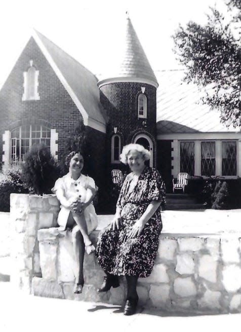 Ida Snyder, Bernard's sister, and Rae Snyder, his mother, chat in front of their house at 2508 Harris Blvd.