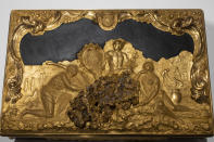 A box gifted to Stadholder William IV as the new governor of the Dutch West India Company (WIC) with decorations referring to the WIC's trade in gold, ivory and people, is displayed at the Slavery exhibition at the Rijksmuseum in Amsterdam, Netherlands, Monday, May 17, 2021. The stark contrast between finery and brutality, wealth and inhumanity is a recurring pattern at the museum's unflinching new exhibition titled, simply, "Slavery", that examines the history of Dutch involvement in the international slave trade. (AP Photo/Peter Dejong)