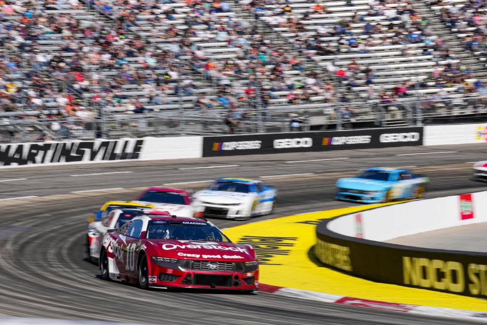 Apr 7, 2024; Martinsville, Virginia, USA; NASCAR Cup Series driver Noah Gragson (10) drives through turn four during the Cook Out 400 at Martinsville Speedway. Mandatory Credit: Jim Dedmon-USA TODAY Sports