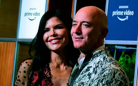 Jeff Bezos and Lauren Sanchez - Credit: Sujit Jaiswal/AFP