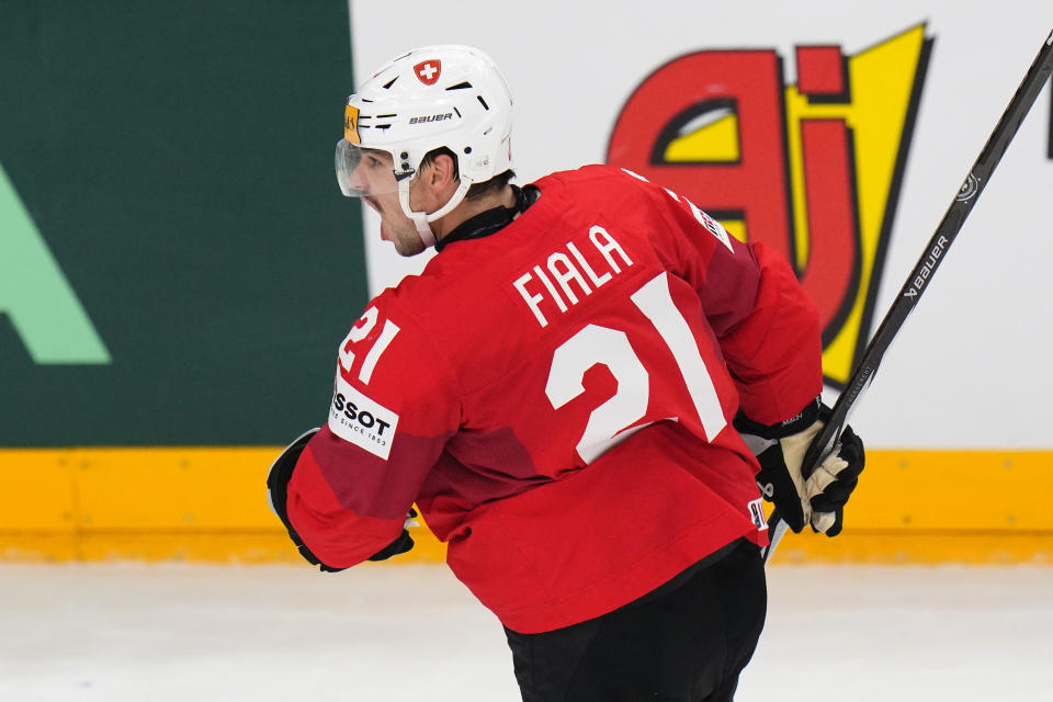 Switzerland's Kevin Fiala celebrates after scoring his sides first goal during the preliminary round match between Canada and Switzerland at the Ice Hockey World Championships in Prague, Czech Republic, Sunday, May 19, 2024. (AP Photo/Petr David Josek)
