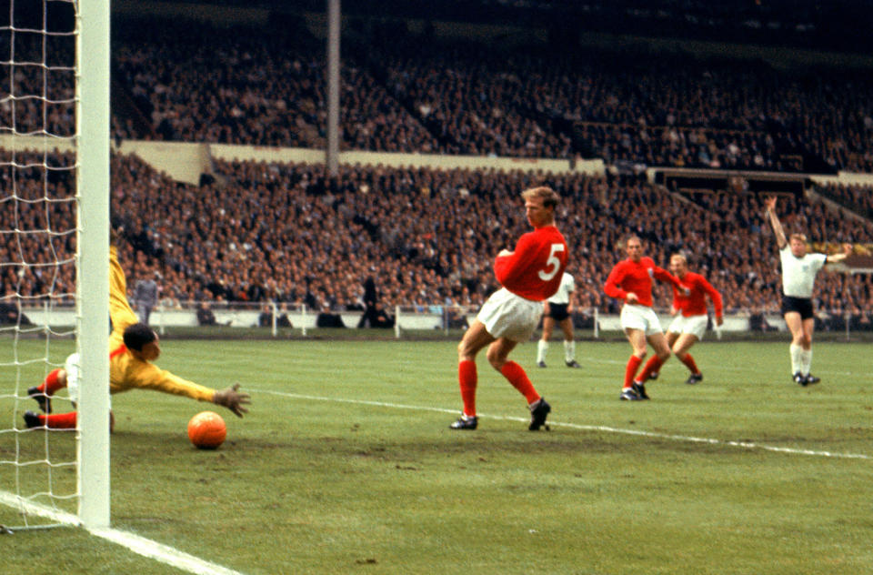 FILE - In this file photo dated July 30, 1966 showing West Germany's Helmut Haller, right, jubilates as his shot beats England goalkeeper Gordon Banks, left, for the opening goal of the World Cup Final in London, watched by England players left to right, Jack Charlton, Ray Wilson, and Bobby Moore. Tributes are being paid to Helmut Haller, who made 33 appearances for West Germany and scored six goals in the 1966 World Cup, after he died Thursday Oct. 11, 2012, aged 73 at his home in Augsburg, Germany, it is announced Friday Oct. 12, 2012. (AP Photo / PA File, PA) UNITED KINGDOM OUT - NO SALES - NO ARCHIVES