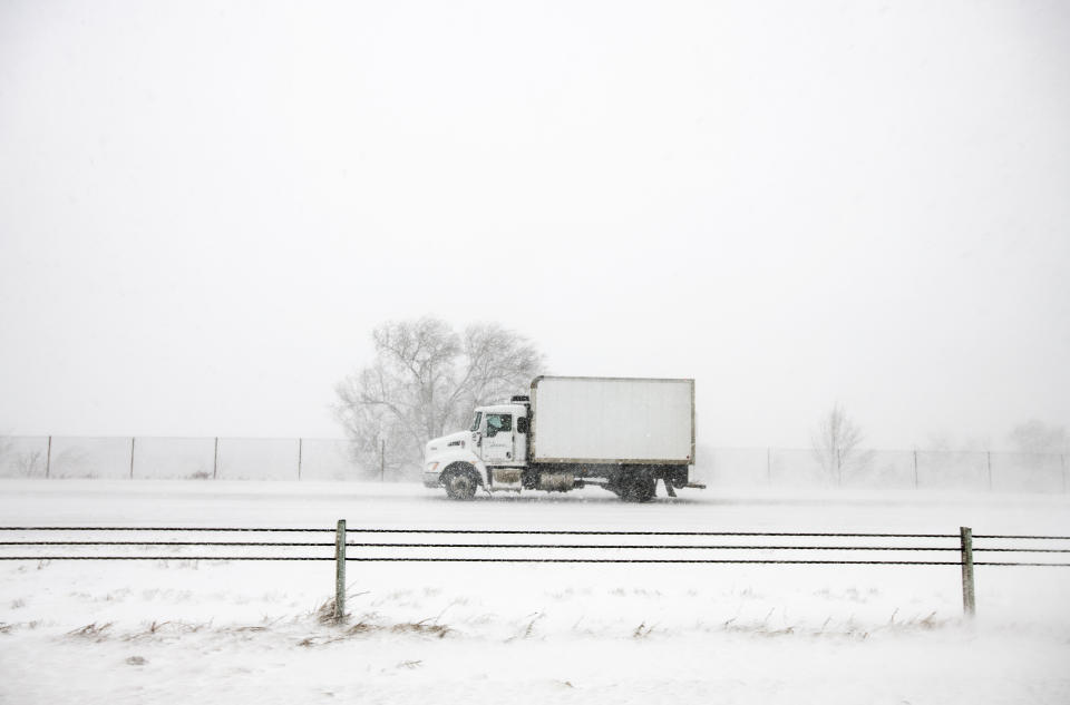 A truck drives north on I-25 during the snowstorm in Colorado Springs, Colo., on Wednesday, March 13, 2019. Some of Colorado's busiest highways are closed as a raging storm brings heavy snow to a wide swath of the West and Midwest. Many schools and state offices were shut down Wednesday amid a blizzard expected to engulf parts of Colorado, Wyoming, Montana, Nebraska and South Dakota. (Kelsey Brunner/The Gazette via AP)