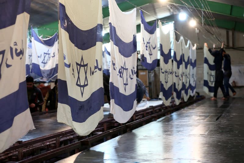 Large flag factory creates U.S. and Israeli flags for Iranian protesters to burn in Khomein City