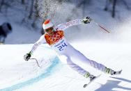 Bode Miller of the U.S. competes in the downhill run of the men's alpine skiing super combined event at the 2014 Sochi Winter Olympics, February 14, 2014. REUTERS/Ruben Sprich