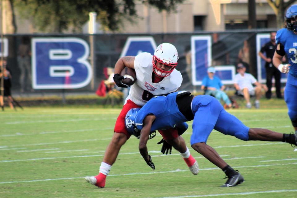 Trinity Christian cornerback Jayke Jones makes a tackle against a NFEI player.