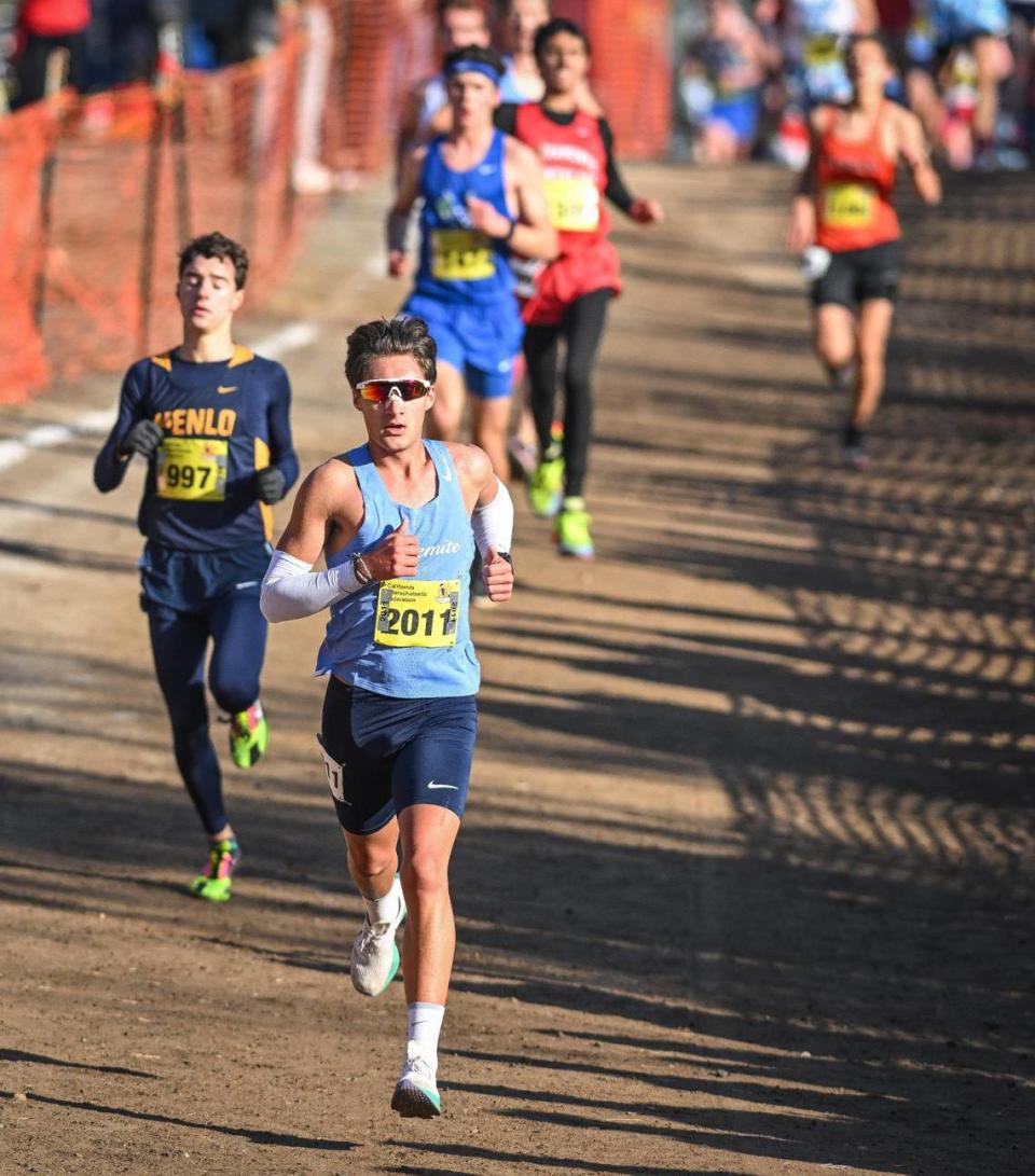 Yosemite High’s Jack Olney comes down the hill in the front pack during the boys Division V state cross country championships at Woodward Park in Fresno on Saturday, Nov. 25, 2023.