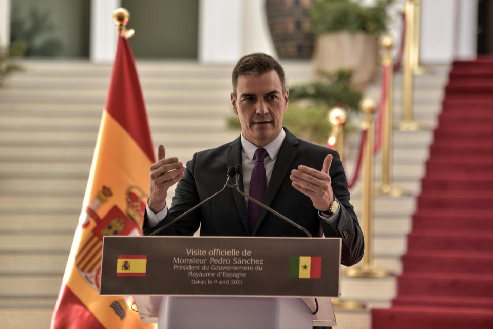 Spanish Prime Minister Pedro Sanchez speaks during a press conference at the Palace of the Republic in Dakar, Senegal, Friday, April 9 2021 after his meeting with Senegalese President Macky Sall. Sanchez is on a mini-tour to two African nations that are key in the European country's new push to bolster ties with the neighboring continent and mitigate the migration flows that many fear could increase as a consequence of the coronavirus pandemic.(Seyllou/Pool Photo via AP)