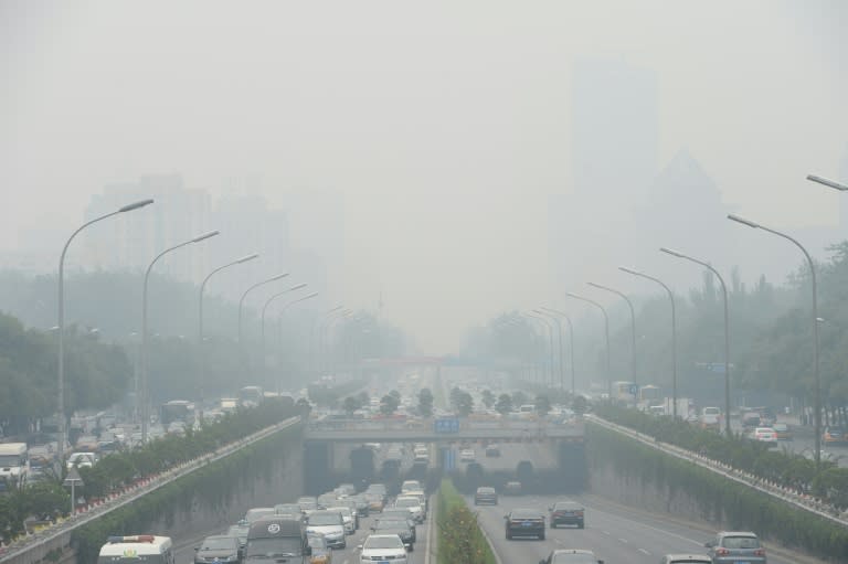 Chinese cities, such as Beijing, pictured in June, are often hit by heavy pollution, blamed on coal-burning by power stations and industry, as well as vehicle use and climatic factors This picture taken on June 23, 2015 shows vehicles running in smog covered streets in Beijing. China's cities are often hit by heavy pollution, blamed on coal-burning by power stations and industry, as well as vehicle use. The issue has become a major source of popular discontent with the Communist Party, leading the government to vow to reduce the proportion of energy derived from fossil fuels. CHINA OUT AFP PHOTO