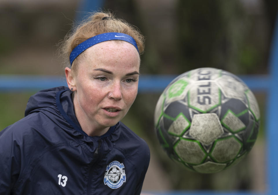 Polina Polukhina, captain of a women's football team from Mariupol, trains ahead the Ukrainian championship match against Shakhtar in Kyiv, Ukraine, Thursday, April 13, 2023. After their city was devastated and captured by Russian forces, the team from Mariupol rose from the ashes when they gathered a new team in Kyiv. They continue to play to remind everyone that despite the occupation that will soon hit one year, Mariupol remains a Ukrainian city. (AP Photo/Efrem Lukatsky)