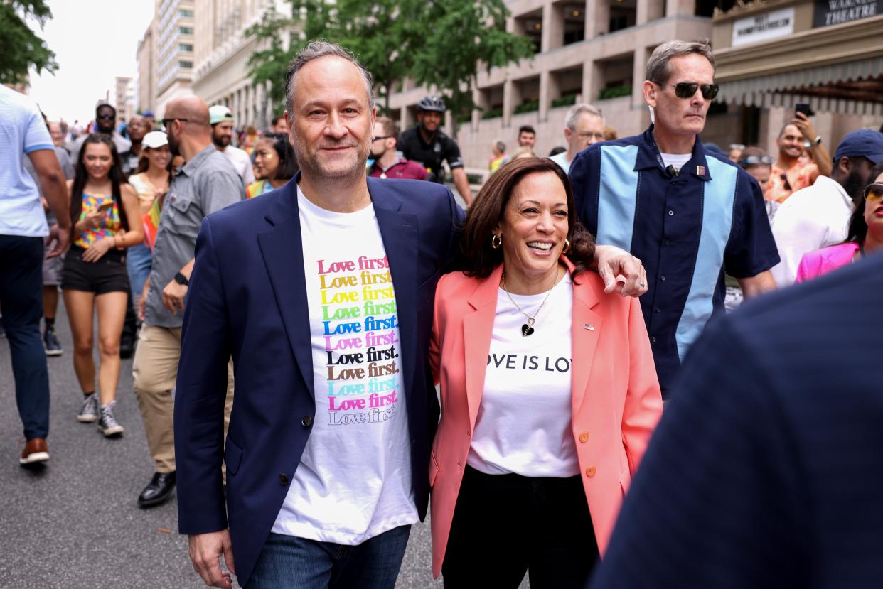 US Vice President Kamala Harris and husband Doug Emhoff join marchers for the Capital Pride Parade on June 12, 2021 in Washington, DC. Mr Emhoff has denied that former President Donald Trump’s plans to visit the US-Mexico border pushed  Vice President Kamala Harris to plan her own trip. (Getty Images)