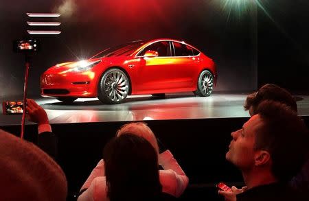 FILE PHOTO: A Tesla Model 3 sedan, its first car aimed at the mass market, is displayed during its launch in Hawthorne, California, U.S. March 31, 2016. REUTERS/Joe White/File Photo