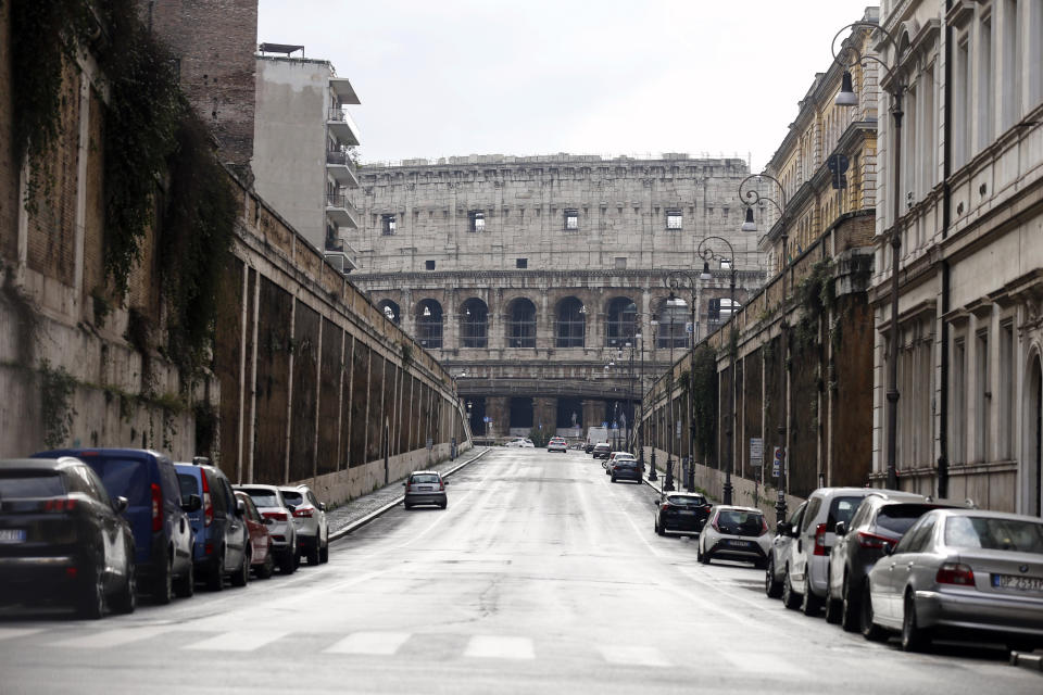 The area around the Colosseum, visible in background, looks deserted, in Rome, Thursday, Dec. 24, 2020. Italy went into a modified nationwide lockdown Thursday for the Christmas and New Year period, with restrictions on personal movement and commercial activity similar to the 10 weeks of hard lockdown Italy imposed from March to May when the country became the epicenter of the outbreak in Europe. (Cecilia Fabiano/LaPresse via AP)