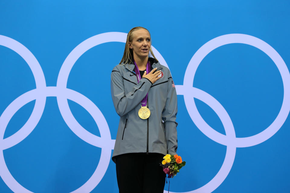 LONDON, ENGLAND - JULY 29: gold medallist Dana Vollmer of the United States poses on the podium during the medal ceremony after setting a new world record time of 55.98 seconds in the Women's 100m Butterfly final on Day 2 of the London 2012 Olympic Games at the Aquatics Centre on July 29, 2012 in London, England. (Photo by Clive Rose/Getty Images)