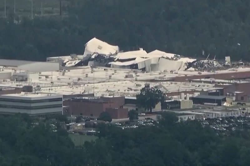 The roof of a Pfizer facility shows heavy damage after a tornado passed the area in Rocky Mount