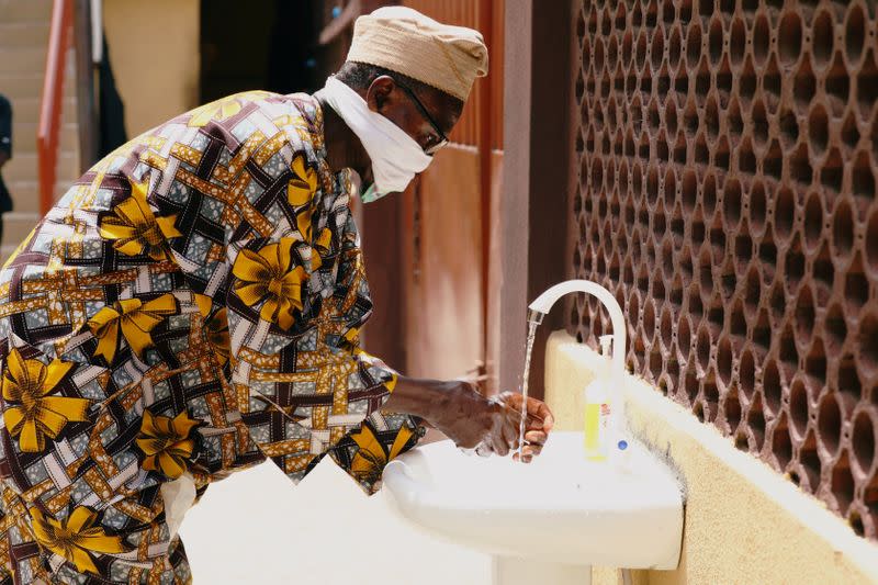 A man washes his hands at the Primary Healthcare Centre, amid the spread of the coronavirus disease (COVID-19), in Lagos