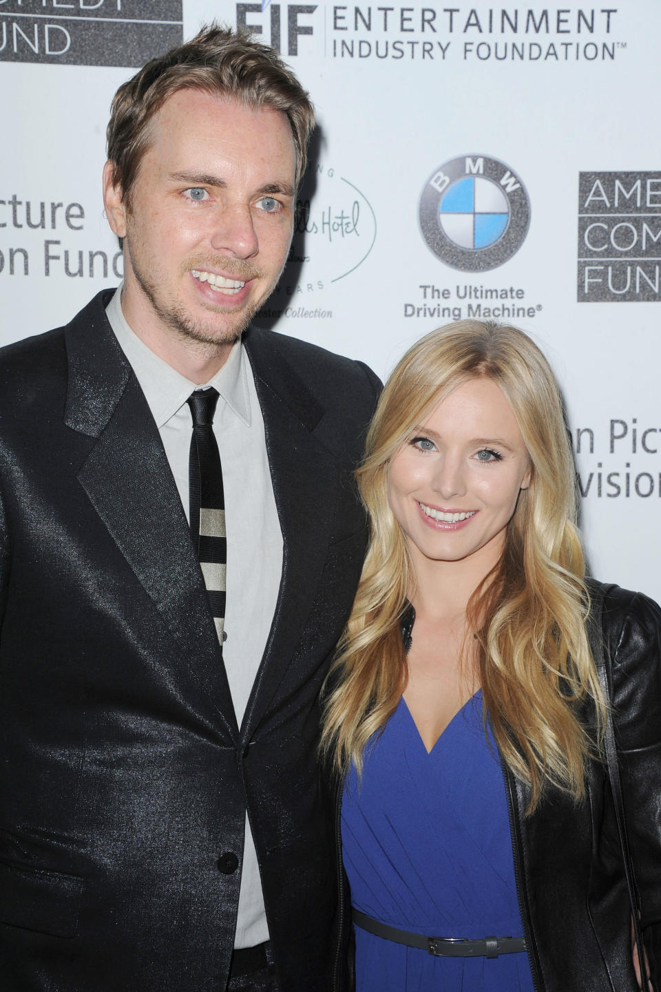 FILE - This June 15, 2012 file photo shows actors Dax Shepard, at left, and Kristen Bell at the 100th Anniversary of The Beverly Hills Hotel - Day 1 in Beverly Hills, Calif. The couple is expecting their first child in late spring, Bell's rep Marcel Pariseau confirms. Shepard, 37, appears on NBC's drama “Parenthood” while 32-year-old Bell has a role on Showtime's “House of Lies” also starring Don Cheadle. She also narrates “Gossip Girl” as the show's title character. They also co-starred in the film “Hit and Run” this summer which Shepard also wrote and directed. (Photo by Katy Winn/Invision/AP, file)