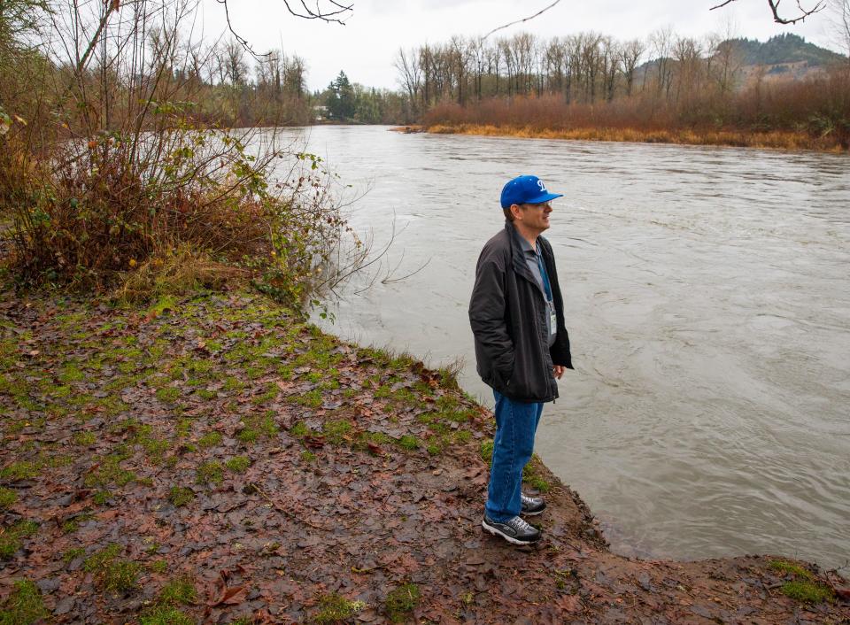 Springfield Mayor Sean VanGordon visits the McKenzie River near North 42nd Street and Marcola Road in Springfield where a levee improvement project is proposed. 