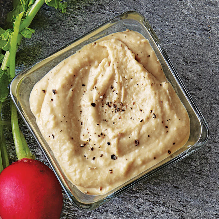 <p>This recipe collection illustrates just how versatile hummus can be. Experimenting with flavors and preparation methods isn't tricky as long as you have mastered a basic hummus, which isn't hard to do. For that reason, we'll start off with <strong>Traditional Hummus</strong>.</p> <p>This Middle Eastern dip is traditionally made with chickpeas, tahini, lemon juice, and olive oil; it lends itself to several variations. Prepare and refrigerate it a day ahead; let it stand at room temperature for 30 minutes before serving. Garnish with a lemon wedge and fresh parsley sprig, and serve with <a rel="nofollow noopener" href="http://www.myrecipes.com/recipe/spicy-baked-pita-chips" target="_blank" data-ylk="slk:Spicy Baked Pita Chips" class="link ">Spicy Baked Pita Chips</a>.</p> <p> <a rel="nofollow noopener" href="http://www.myrecipes.com/recipe/traditional-hummus-10000001853926/" target="_blank" data-ylk="slk:View Recipe: Traditional Hummus" class="link ">View Recipe: Traditional Hummus</a></p>