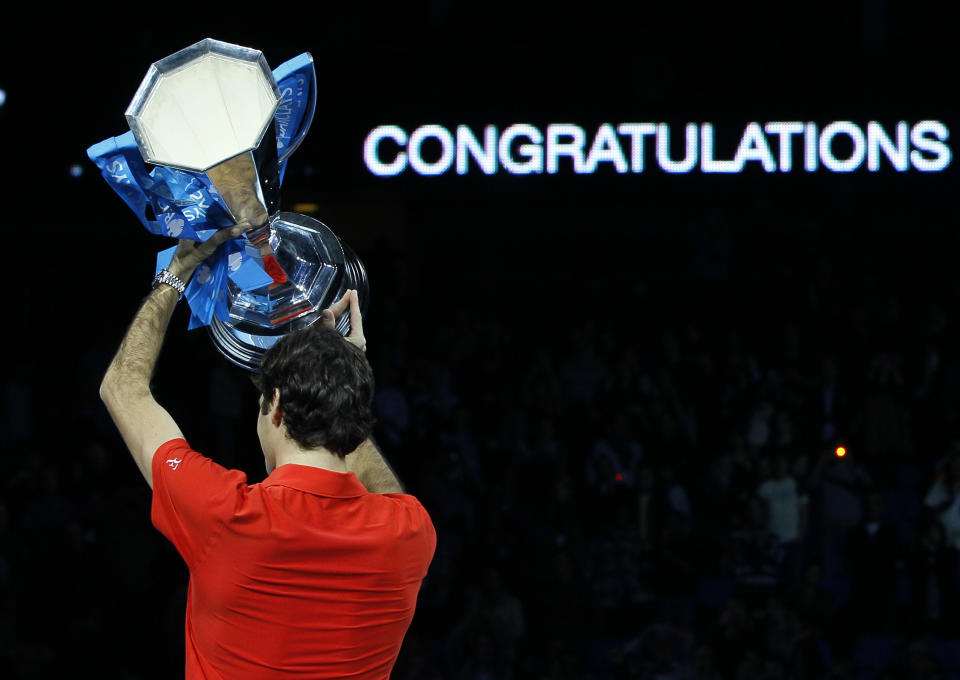 FILE - Switzerland's Roger Federer celebrates as he holds the trophy after beating Spain's Rafael Nadal to win the singles final tennis match at the ATP World Tour Finals at the O2 Arena in London, Sunday, Nov. 28, 2010. Federer announced Thursday, Sept.15, 2022 he is retiring from tennis. (AP Photo/Kirsty Wigglesworth, File)