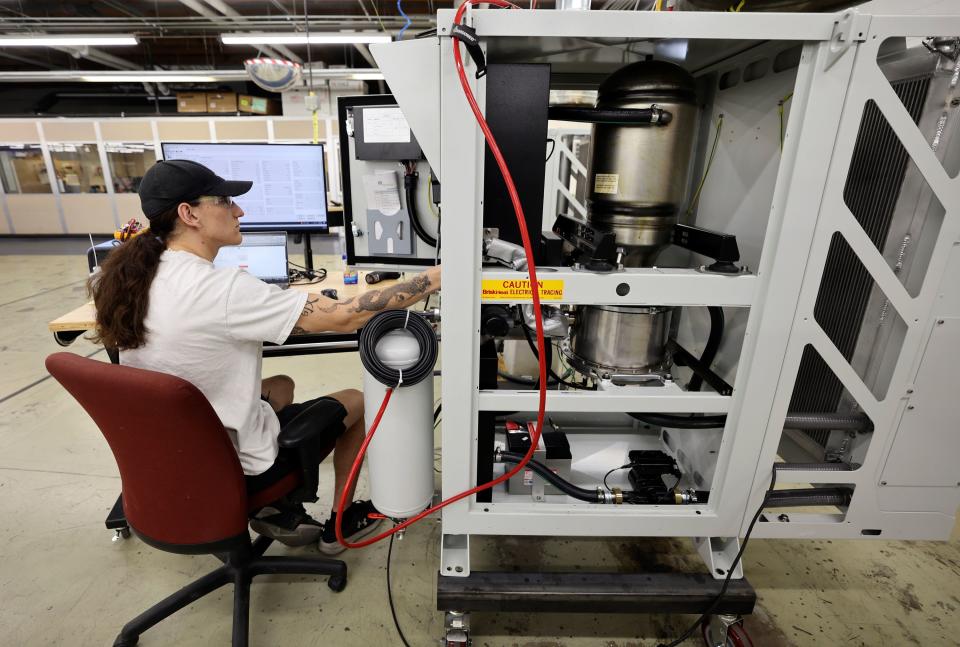 Qnergy ATP technician Ethan Rogers tunes a PowerGen 5650 at Qnergy in Ogden on Thursday, May 25, 2023. | Kristin Murphy, Deseret News