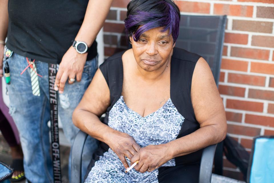 The family of 21-year-old Ta'Kiya Young, the 21-year-old pregnant woman killed Thursday, Aug. 24, 2023 along with her baby girl fetus when she was fatally shot by Blendon Township police, sit outside their Columbus home on Friday, Aug. 25, 2023, including her grandmother, 61-year-old Nadine Young.  Ta'Kiya was due in November.