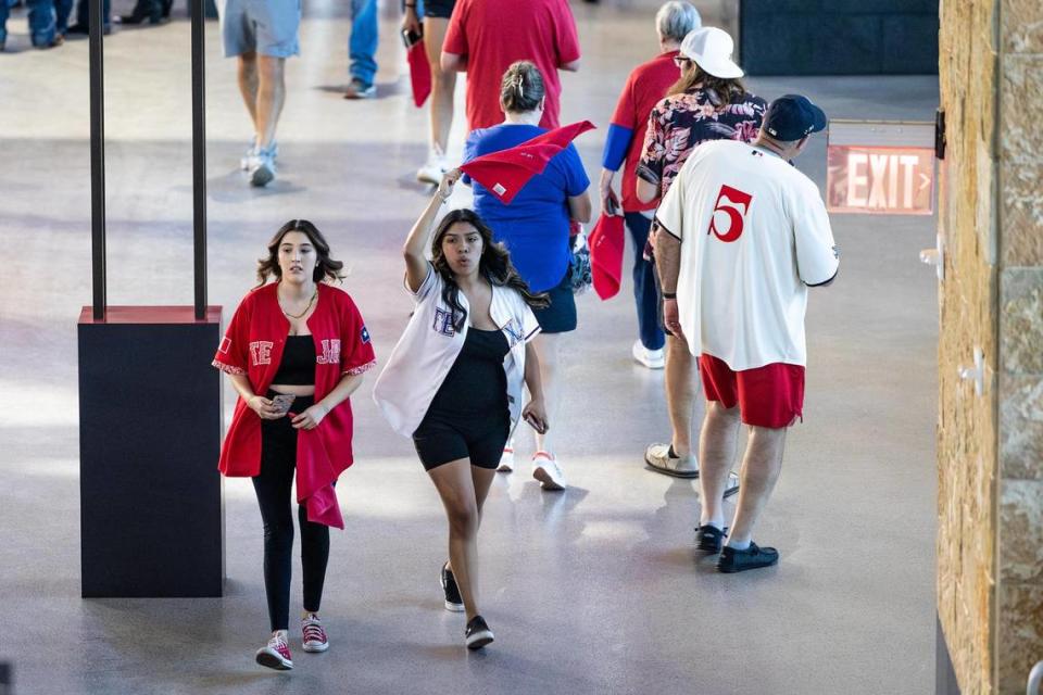 Fans begins to enter the stadium before Friday’s game at Globe Life Field.