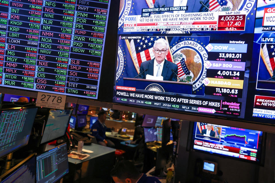FTSE  Screens on the trading floor at New York Stock Exchange (NYSE) display the Federal Reserve Chair Jerome Powell during a news conference after the Federal Reserve announced interest rates will raise half a percentage point, in New York City, U.S., December 14, 2022. REUTERS/Andrew Kelly