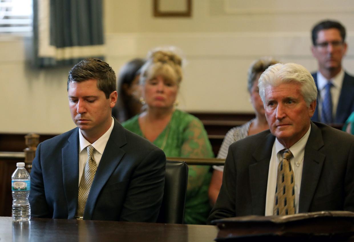 Former University of Cincinnati police officer Raymond Tensing, left, and his attorney Stew Mathews listen as Hamilton County Common Pleas Judge Leslie Ghiz declares a mistrial on Friday, June 23, 2017 in Cincinnati. Tensing was charged with murder and voluntary manslaughter in the shooting of unarmed black motorist Sam DuBose during a 2015 traffic stop. (Cara Owsley /The Cincinnati Enquirer via AP, Pool) - The Cincinnati Enquirer