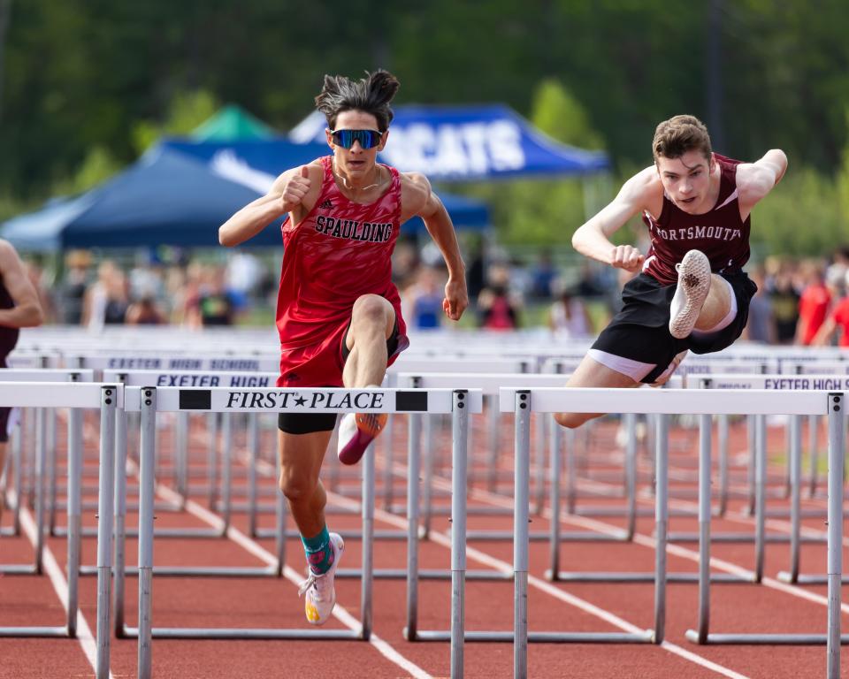 Portsmouth's Josh Kelly beats Spaulding's Matthew Scamman to the last hurdle in the 110-meter hurdles at Friday's Seacoast Track Championship meet at Exeter High School.