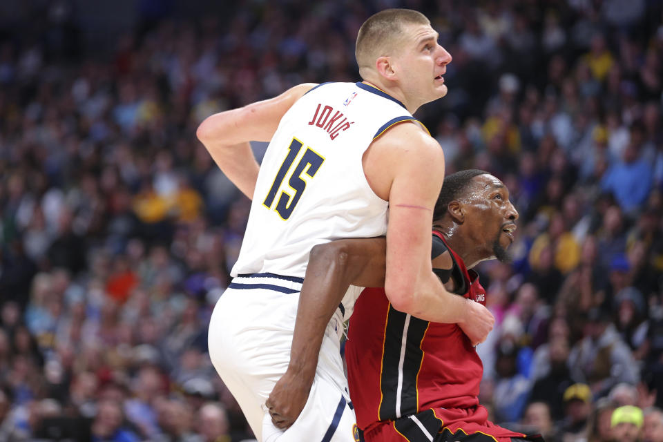 DENVER, CO - DECEMBER 30: Bam Adebayo #13 of the Miami Heat boxes out Nikola Jokic #15 of the Denver Nuggets during the third quarter at Ball Arena on December 30, 2022 in Denver, Colorado.  NOTE TO USER: User expressly acknowledges and agrees that, by downloading and or using this photograph, user is consenting to the terms and conditions of the Getty Images License Agreement.  Mandatory Copyright Notice: Copyright 2022 NBAE (Photo by C. Morgan Engel/Getty Images)