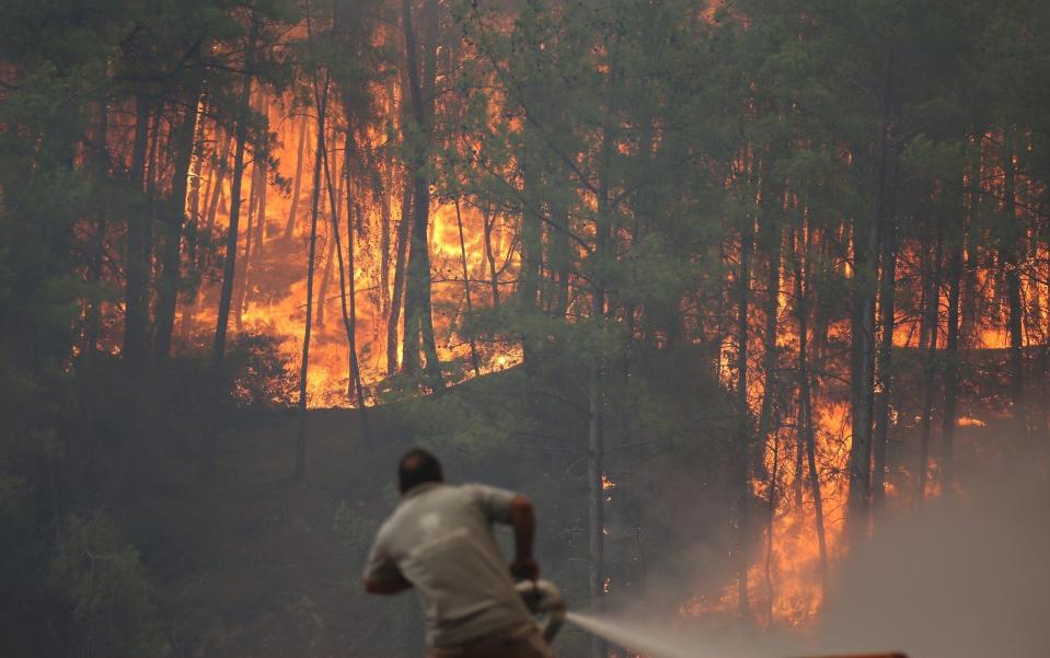 Firefighters battle forest fires in the Manavgat district of Antalya, southern Turkey, on August 2 - Suleyman Elcin/Anadolu Agency via Getty Images