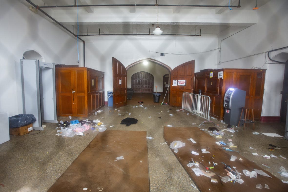 Debris litters the main entrance of the Main Street Armory on March 6, 2023 in Rochester, New York following a stampede that left one dead and several injured. (AP Photo/Lauren Petracca)