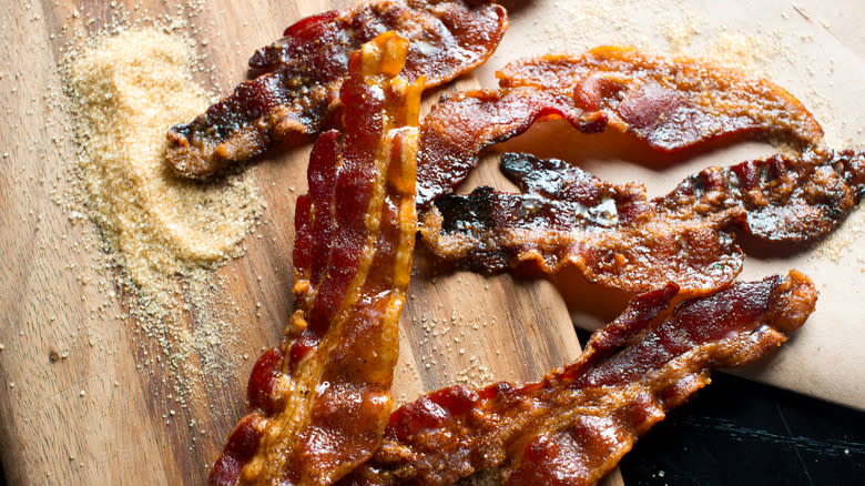 caramelized bacon on wooden board