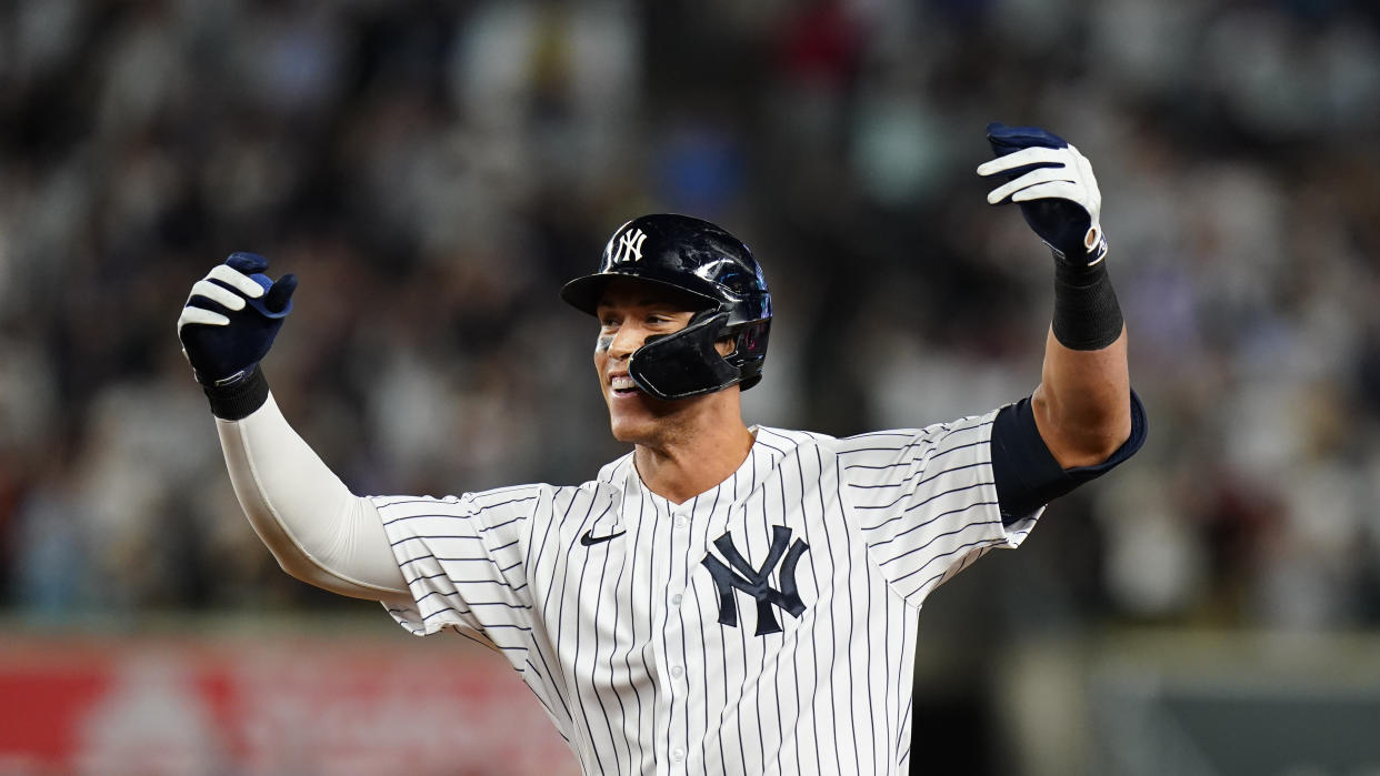 New York Yankees' Aaron Judge gestures to teammates after hitting a game winning RBI single during the ninth inning of a baseball game against the Houston Astros Thursday, June 23, 2022, in New York. The Yankees won 7-6. (AP Photo/Frank Franklin II)