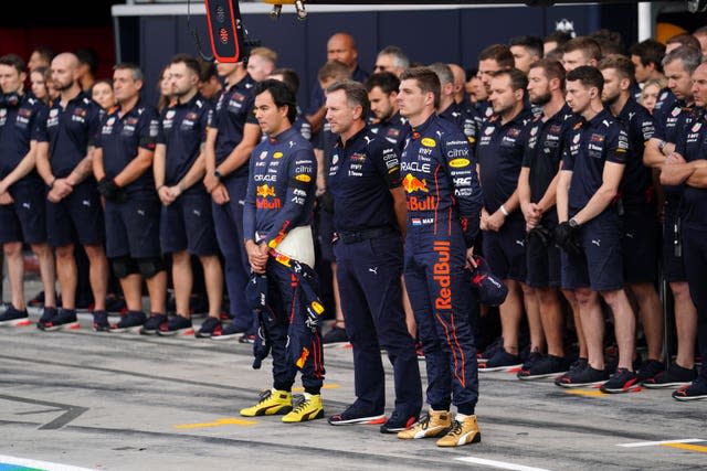 Red Bull team principal Christian Horner (centre) and Sergio Perez (left) and Max Verstappen observe Friday's one-minute silence in memory of the Queen
