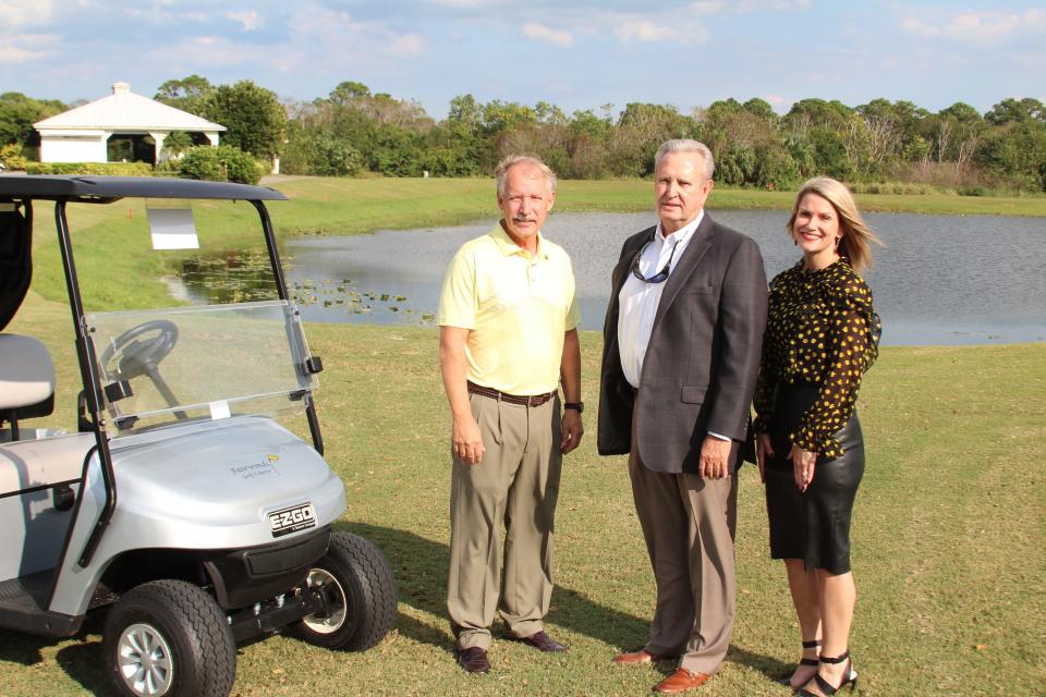 St. Lucie County Administrator Howard Tipton, left, Larry Dale, president of Dickerson Florida Inc., and United Way of St. Lucie County's Campaign Director Roxanne Hall at Fairwinds Golf Course, Fort Pierce.