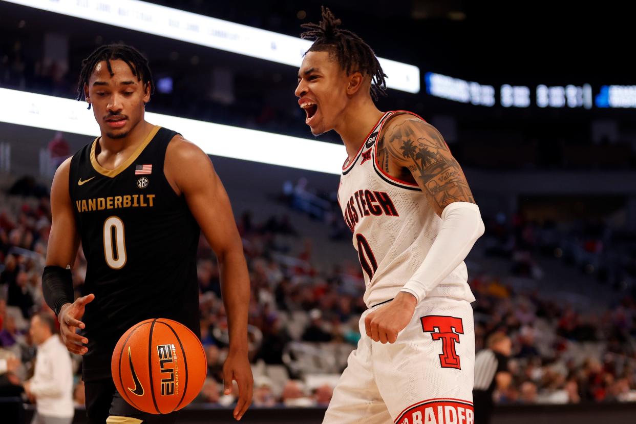 Texas Tech's Chance McMillian (0) yells out after dunking the ball around Vanderbilt's Tyrin Lawrence (0) in US LBM Coast-to-Coast Challenge basketball game, Saturday, Dec. 16, 2023, at Dickies Arena in Fort Worth.