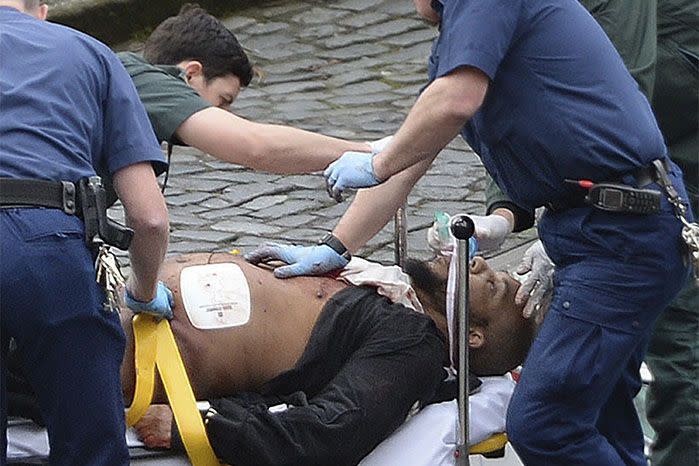 The suspected attacker is treated by paramedics. Photo: Getty