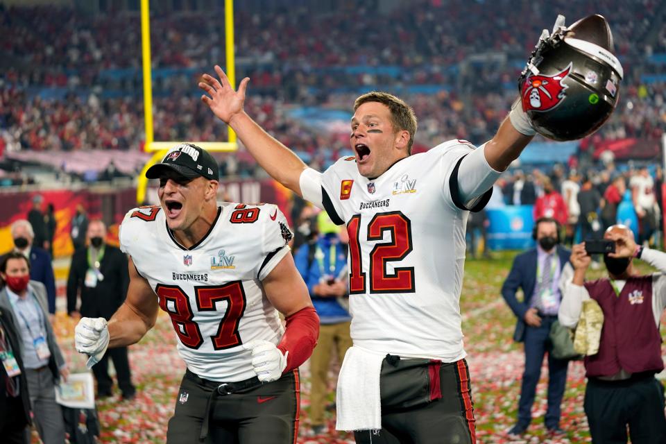 Tampa Bay Buccaneers tight end Rob Gronkowski, left, and quarterback Tom Brady (12) celebrate after the NFL Super Bowl 55 football game against the Kansas City Chiefs in Tampa, Fla., Feb. 7, 2021.