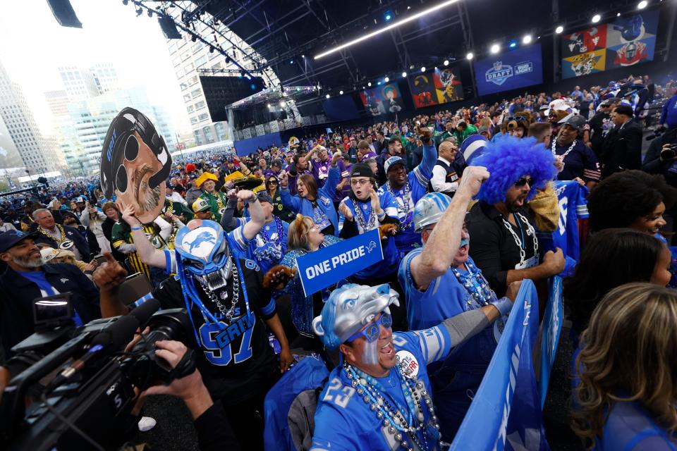 Detroit Lions fans inside the NFL draft theater celebrate as the master of ceremonies recognized them before the start of the draft in Detroit on Thursday, April 25, 2024.