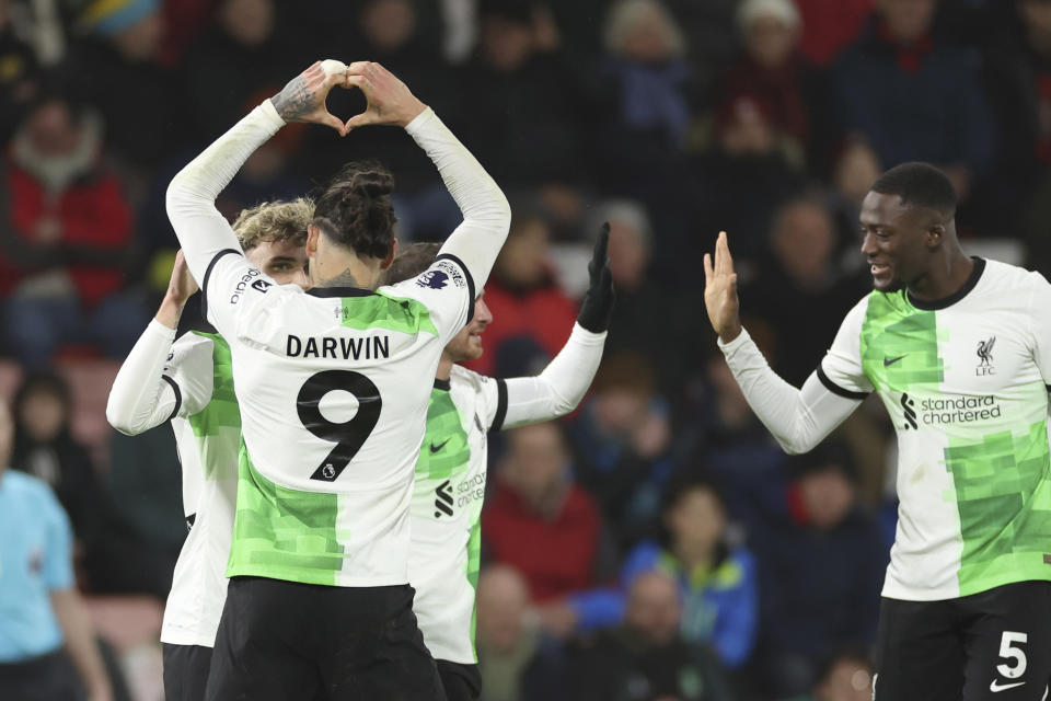 Liverpool's Darwin Nunez, left, celebrates with teammates after scoring his side's fourth goal during the English Premier League soccer match between AFC Bournemouth and Liverpool at the Vitality Stadium, in Bournemouth, England, Sunday, Jan. 21, 2024. (AP Photo/Ian Walton)