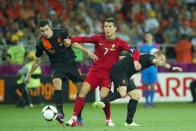 (L-R) Robin van Persie of Holland,Cristiano Ronaldo of Portugal,Wesley Sneijder of Holland during the UEFA EURO 2012 match between Portugal and Netherlands at the Metalist Stadium on June 17, 2012 in Kharkov, Ukraine. (Photo by VI Images via Getty Images)