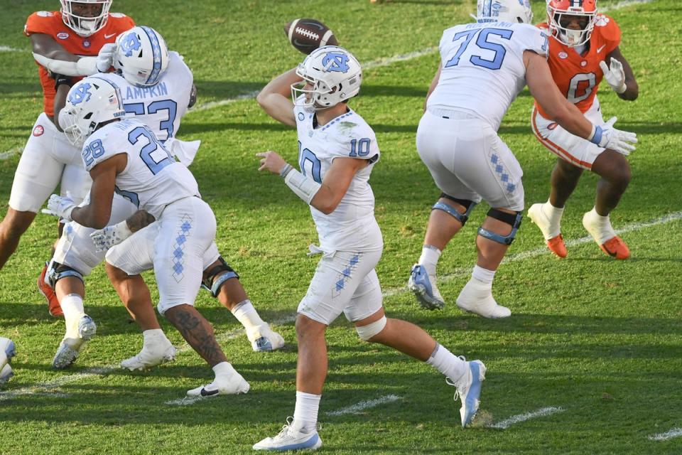 Nov 18, 2023; Clemson, South Carolina, USA; North Carolina Tar Heels quarterback Drake Maye (10) throws a pass against the Clemson Tigers during the first quarter at Memorial Stadium. Mandatory Credit: Ken Ruinard-USA TODAY Sports