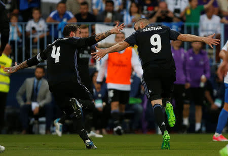 Football Soccer - Malaga v Real Madrid - Spanish Liga Santander - La Rosaleda, Malaga, Spain - 21/5/17 Real Madrid’s Karim Benzema celebrates scoring their second goal with Sergio RamosReuters / Jon Nazca