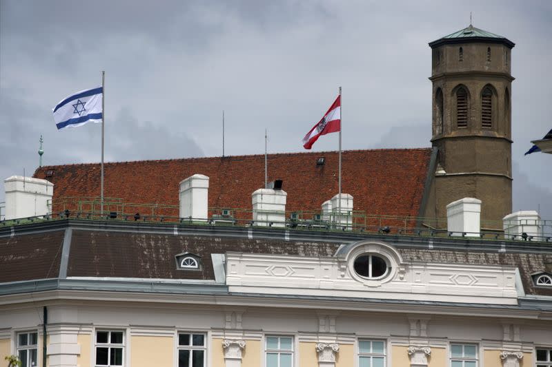 The national flag of Israel is seen atop the federal chancellery in Vienna