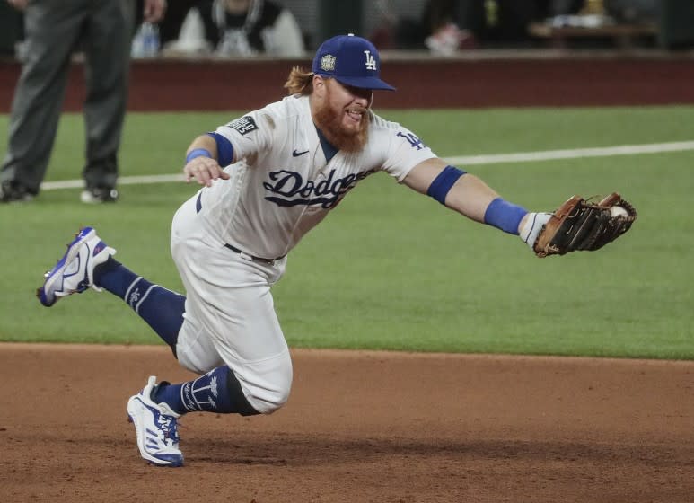 Arlington, Texas, Tuesday, October 20, 2020 Los Angeles Dodgers third baseman Justin Turner (10) snags a grounder hit by Tampa Bay Rays first baseman Yandy Diaz (2) for the first out in the sixth inning in game one of the World Series at Globe Life Field. (Robert Gauthier/ Los Angeles Times)