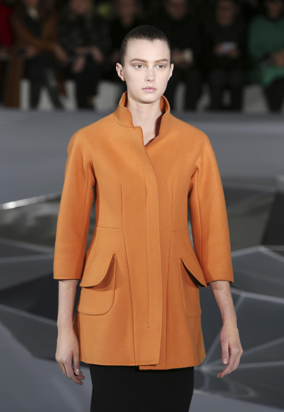 A model wears a creation for Jil Sander women's Fall-Winter 2013-14 collection, part of the Milan Fashion Week, unveiled in Milan, Italy, Saturday, Feb. 23, 2013. (AP Photo/Antonio Calanni)