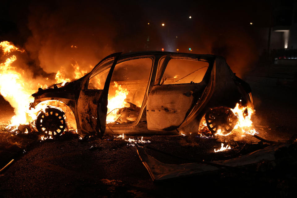 A vehicle burns during a protest in Nanterre, west of Paris, on June 27, 2023, after French police killed a teenager who refused to stop for a traffic check in the city.<span class="copyright">Zakaria Abdelkafi—AFP/Getty Images</span>